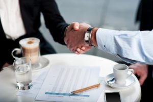 Businessman and client handshake