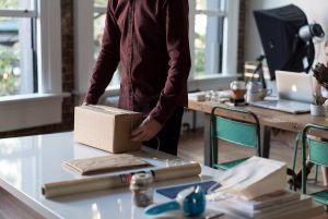 man packing an item