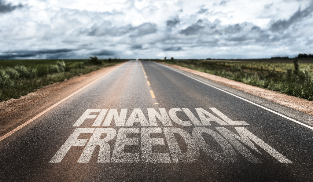 financial freedom written on a road