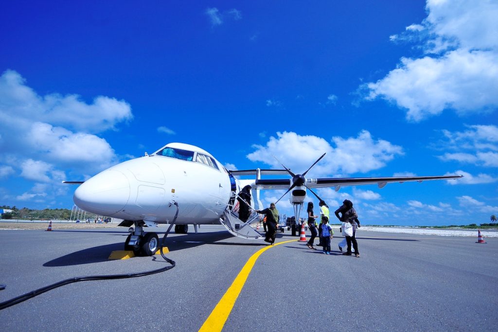 people boarding a private plane